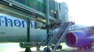 Gate docking up with a Thomas Cook A330 G-OJMC