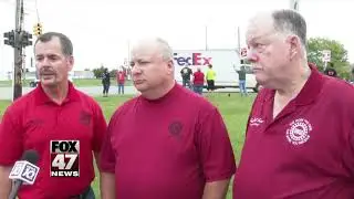 Union members walking the picket line at GM plant in Delta Township