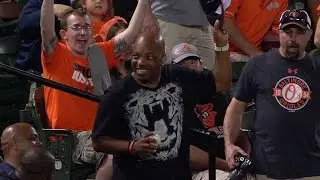 LAA@BAL: Fan uses hat to snag a foul-ball souvenir