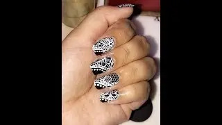 White Stamping Nailart Design on Black Nails