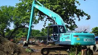 Long Reach Excavator Kobelco SK210LC Digging A Pond In The Zoo