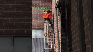 Silicone sealant application to movement joint on brick wall