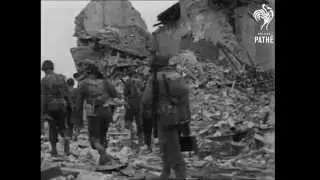 Yanks in Quineville Normandy shelled by Germans and prisoners march trough Carentan 1944