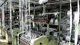 Zipper tape weaving machine is in operation