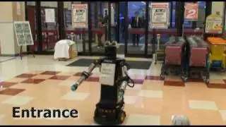 Robovie II helps elderly customers in a supermarket