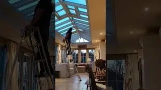 Cleaning conservatory ceiling on a quiet afternoon