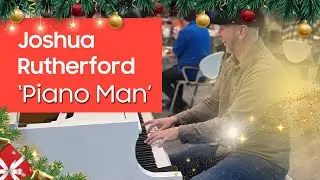 Senior engineer Joshua Rutherford plays the piano, serenades colleagues during holiday season