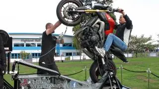 Giacomo Agostini wheelies a Yamaha MT-09