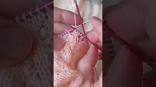 Two knit stitches together with a left tilt.
