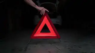 reflective road warning triangle to be used in the event of a car breakdown