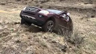 Mercedes ML500 climbing 100% grade/45 degree damp dirt hill.