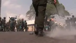 Cambodia police use smoke grenades to break up independent tv rally