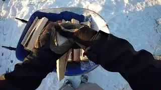 Splitting wood in Maine and stacking wood