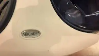 3 Essick Air (AirCare) evaporative humidifiers at a Guitar store