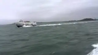 VIII blowing by 20 knot commuter boat