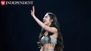 Olivia Rodrigo falls through stage during concert