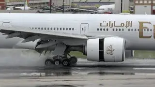 EMIRATES BOEING 777 landing with Rain at Lisbon Airport
