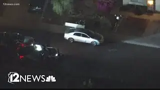 Police surround house near 107th Avenue and Camelback Road