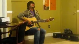 Tam Garcia playing the acoustic guitar at Beanwood