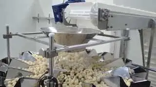 Linea di confezionamento per gnocchi con pesatrice multitesta