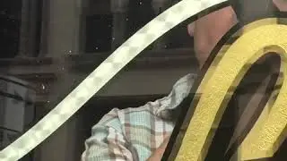 Sign Artist and gilder, Robert Frese engine turning gold leaf on glass in reverse.