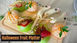 Making a definitely scary Halloween fruit platter