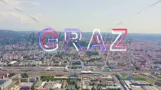 Inscription on video. Graz, Austria. The historic city center aerial view. Mount Schlossberg (Castle