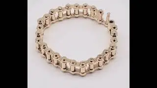 solid 14k gold bicycle chain bracelet.  104grams 8.25inches long, 15.4mm wide