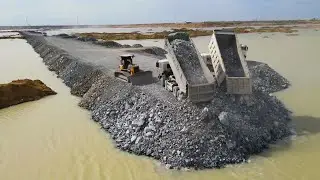 Very Nice action Heavy Dump Truck Unloading Rock With Best Talent Dozer In Operation New Road build