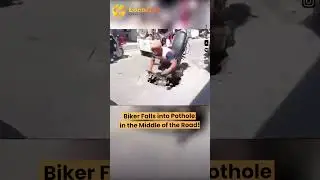 Biker Falls into Pothole in the Middle of the Road!