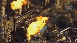 A fire breathing chimney in an oil refinery #process #chimney #factory