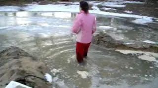Bear Grylls walking through a Frozen Pond
