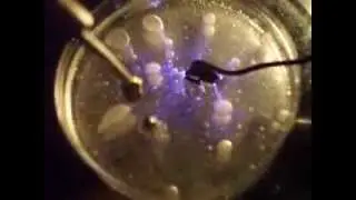 Magnetic sphere moving in alternating rotating field showing boundary layer effects upon liquid.
