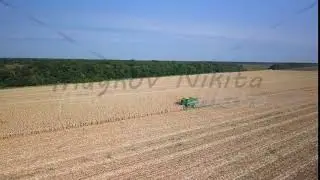 Harvesting of corn. Harvester gather corn from the field. Russia, From Dron, Point of interest