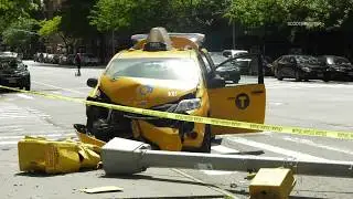 Taxi Cab Crashes into Traffic Light, Causes Collapse
