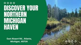 56 Acres of Woodlands & Waterfront Serenity in Atlanta MI