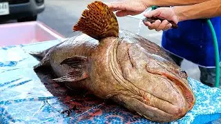Тайская уличная еда - Гигант жареная рыба окунь Бангкок морепродукты Таиланд