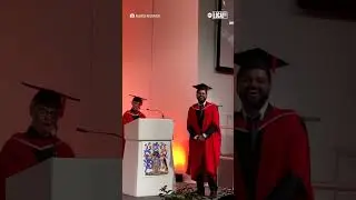 Daughter cheers on dad during graduation