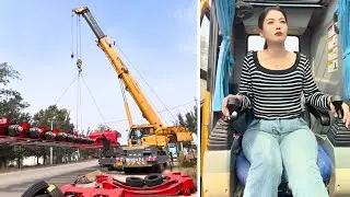 Female Crane Operator Heze Lifting Heavy Semi-Trailer Axle Assembly