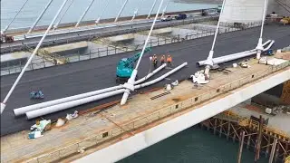 2026.01.08  淡江大橋  淡水端 主橋塔淡水側南下車道瀝青鋪設後 超大燈柱立柱排列 等待吊裝 橋底拔H 型鋼鋼施工  概況觀察 空拍 LIVE 直播