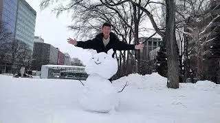 Building snowman at Odori Park, Hokkaido.