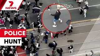Victoria Police hunting eight masked offenders for throwing rocks at protest | 7NEWS