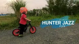 2-year old on a balance bike doing bits of tricks