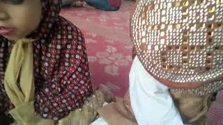 Children reciting a prayer before eating bakora.