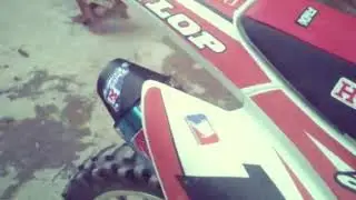 Honda CRF 230F cambio de escape original por AKRAPOVIC