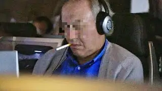Guy Smoking on a Plane