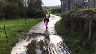 Whit leaping across a puddle ...