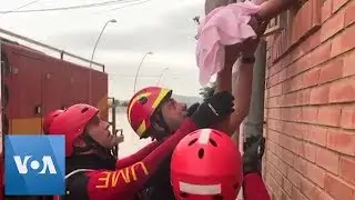 Dramatic Footage Shows Baby Rescue Amid Spain Floods