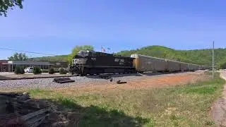 NS 4838 leads the short, southbound graffiti train through the cut in Collegedale..NS 7519 as a DPU