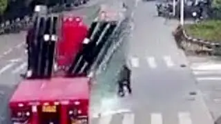 Glass panes from truck collapse on scooter rider